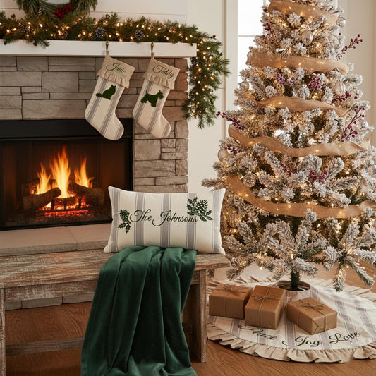 Heritage Collection ticking stripe Christmas stockings, personalized family pillow, and tree skirt styled in cozy holiday living room.